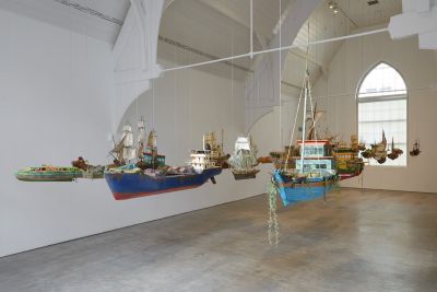 Installation view of the ‘Here’s the Thing’ exhibition at the Ikon Gallery, Birmingham, 2019, showing Hew Locke RA, Armada, 2017-19. Courtesy the artist and Ikon Gallery. Photo: Stuart Whipps
